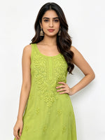 A woman modelling a sleeveless lime green kurta with detailed floral embroidery on the bodice, set against a plain white studio background.