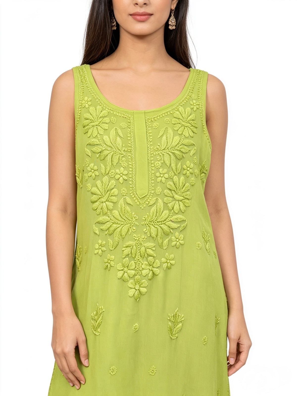 A woman wearing a sleeveless lime green tunic viscose fabric dress with mulmul lining hand embroidered intricate floral embroidery on the front, shown against a plain white background.