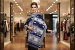 A woollen weaved scarf with a double-sided design, featuring a maple traditional pattern on borders and in the middle, primarily in navy blue and white colours. 2. 5 Yard long and 1 yard wide shawl by Famaza Couture 