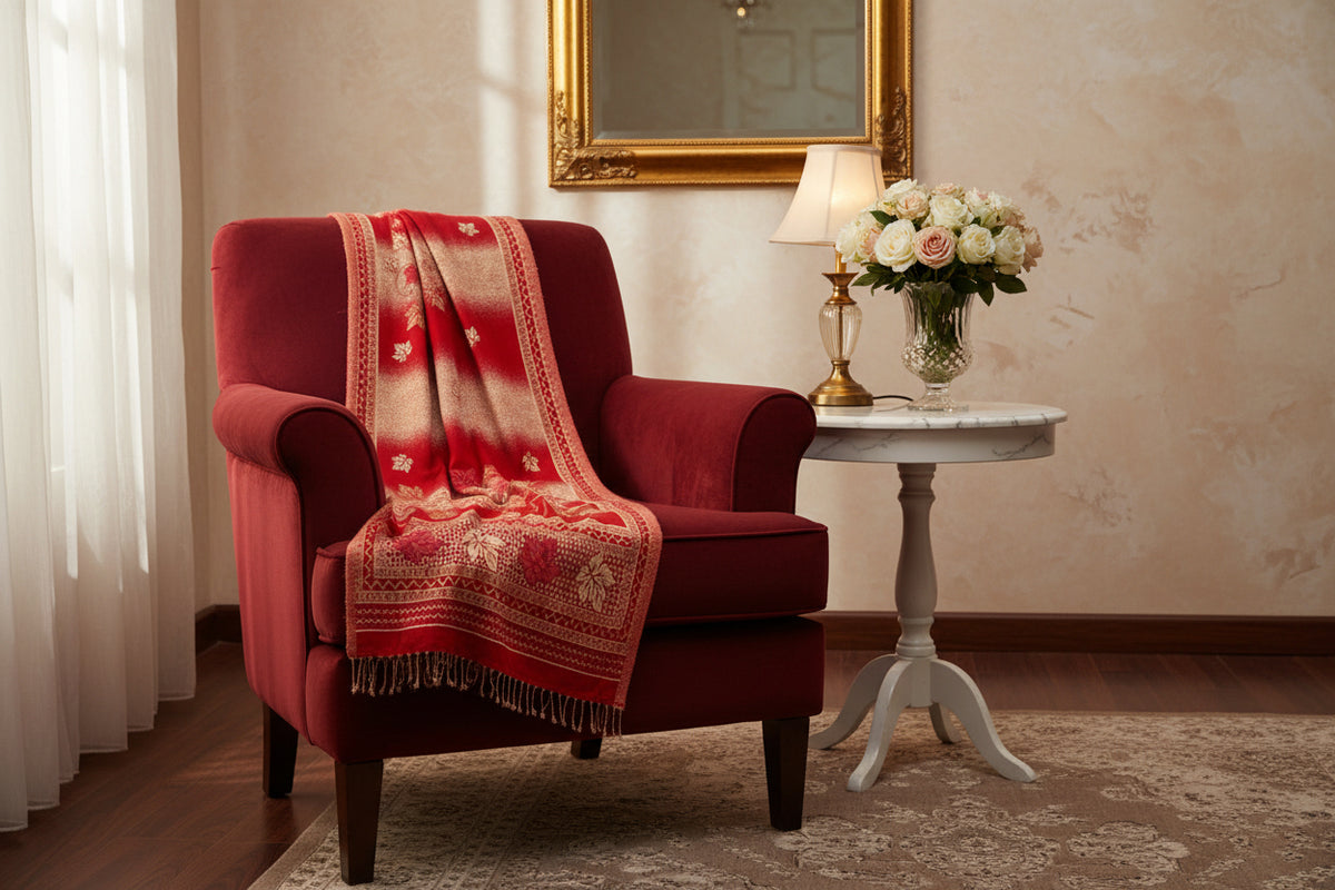 A woollen weaved scarf with a double-sided design, featuring a maple traditional pattern on borders and in the middle, primarily in red and beige colours. 2. 5 Yard long and 1 yard wide shawl.