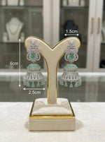 American diamond bell jhumnka earrings with mint green and white cubic zirconia stones earrings with measurements. 