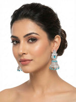 American diamond bell jhumnka earrings with sky blue and white cubic zirconia stones.