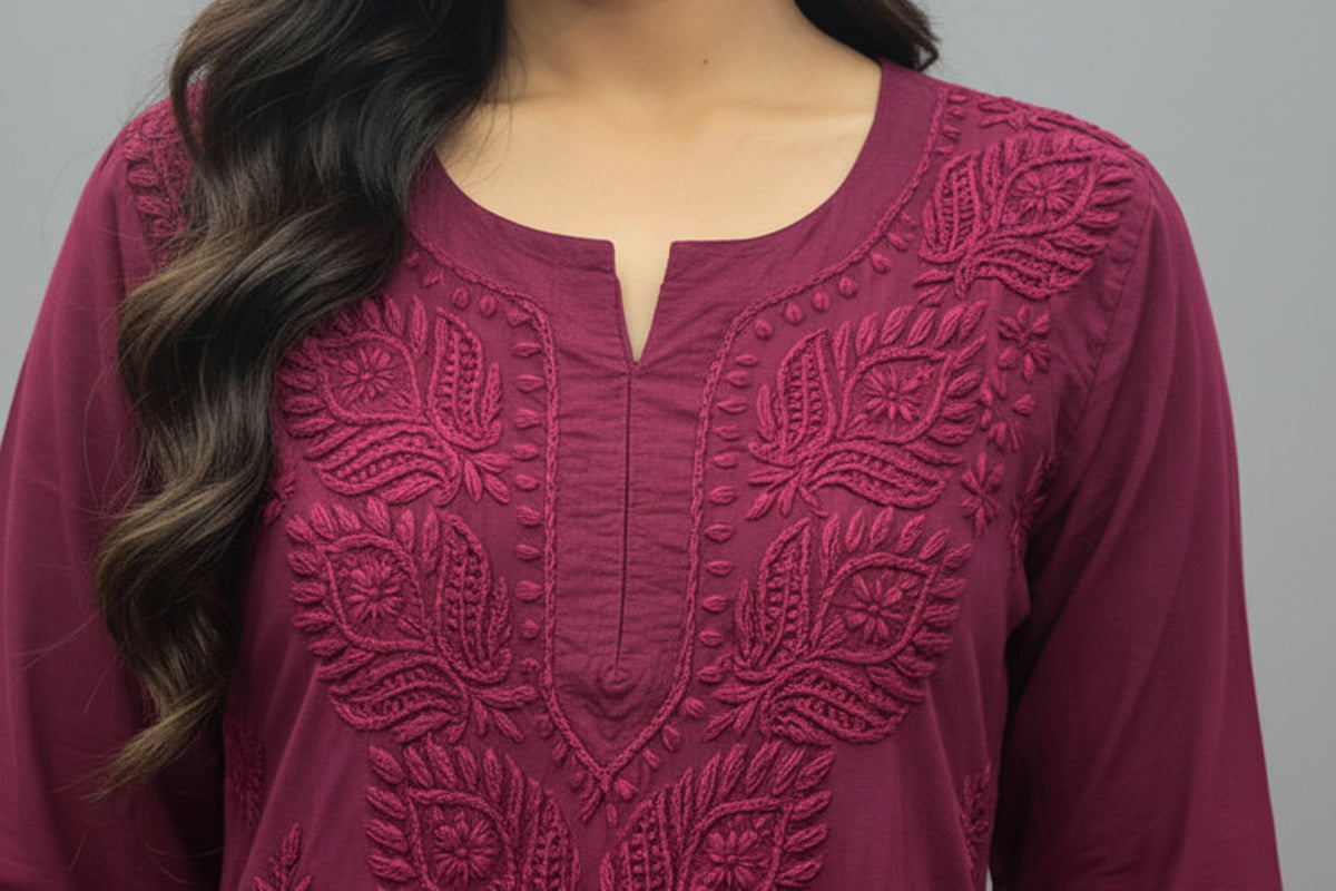 Close-up view highlighting the detailed neckline and intricate leaf embroidery on a deep plum short kurti, presented as a standalone short kurti without bottom trousers.