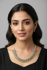  An oxidised silver necklace featuring floral links and square yellow stones.