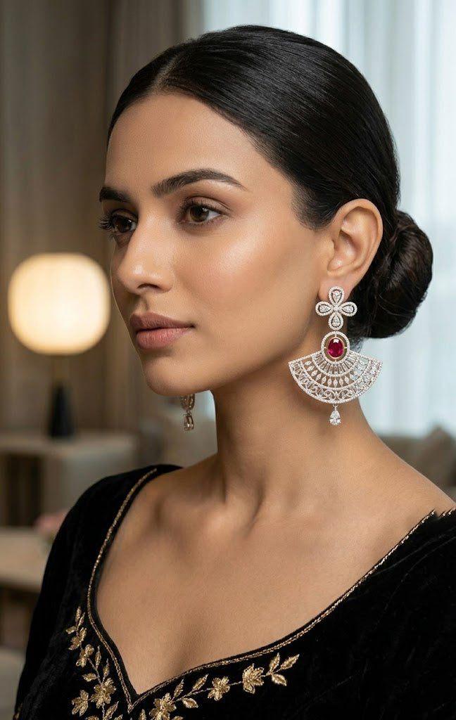 On-model view of the Aria luxury fan-shaped drop earring, showcasing its size and brilliant sparkle when worn with traditional embroidered attire.
