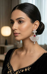 On-model view of the Aria luxury fan-shaped drop earring, showcasing its size and brilliant sparkle when worn with traditional embroidered attire.