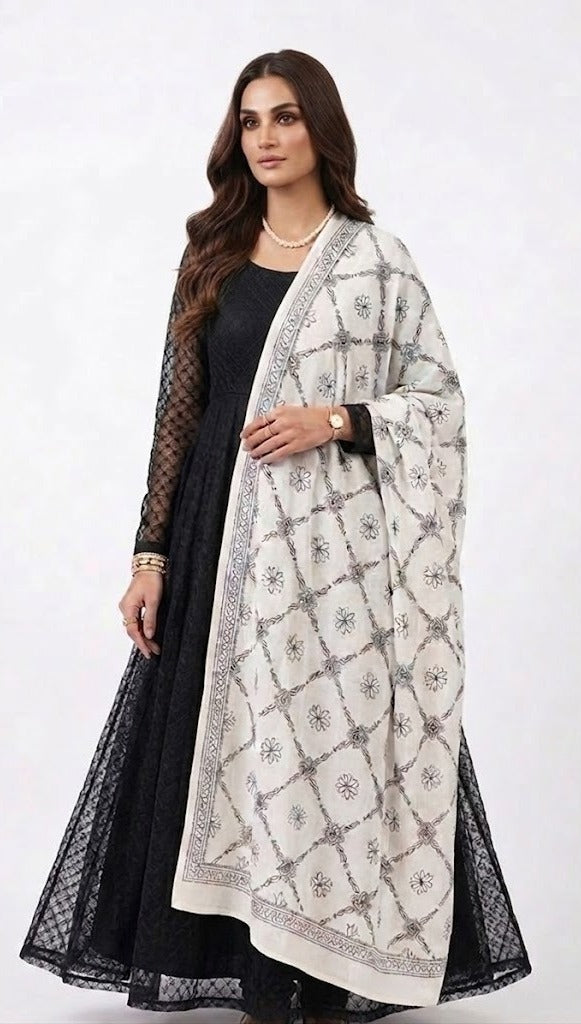 Model wearing a monochrome floral lattice Bakhiya embroidered cotton dupatta over a black dress.