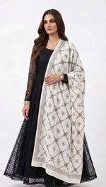Model wearing a monochrome floral lattice Bakhiya embroidered cotton dupatta over a black dress.