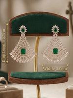 A pair of large drop earrings displayed on a wooden and velvet jewelry stand, with overlaid dimension labels showing drop length 6.5 cm, width 5.