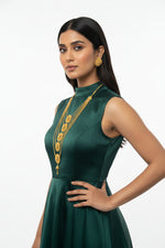 A side-profile view of a model wearing the Ayesha Majestic gold-plated multi-layered necklace set with matching stud earrings by Famaza Couture, displayed against a clean white background.