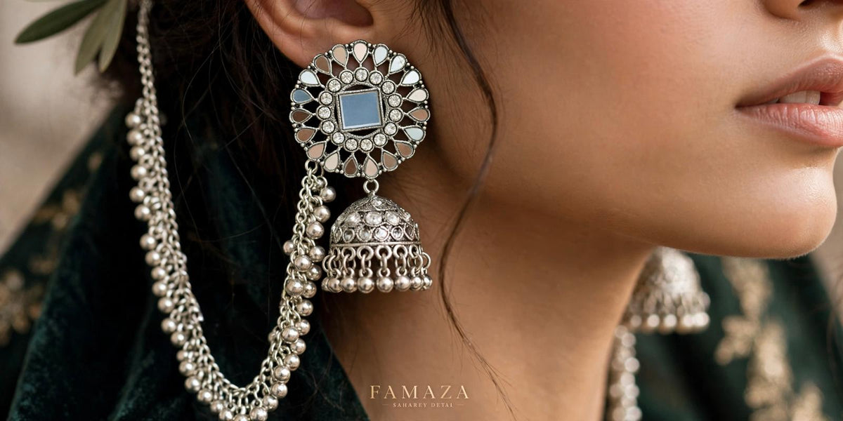 Model wearing Mirror Majesty oxidised silver-tone mirror jhumka earrings with a floral top and beaded Sahara chain