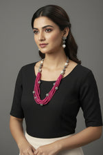 Beaded mala with silver and pearl beads in on both sides start and drop is designed with Twisted hot pink colour glass nano beads and silver balls beads, along withLotus design earrings with silver and pearl beads in drop. Oxidised jewellery set. 