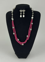 Beaded mala with silver and pearl beads in on both sides start and drop is designed with hot pink colour glass nano beads and silver balls beads, along withLotus design earrings with silver and pearl beads in drop. Oxidised party wear jewellery set. 