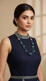 Beaded mala with silver and pearl beads in on both sides start and drop is designed with navy blue nano glass bead with silver ball beads, along withLotus design earrings with silver and pearl beads in drop. Oxidised jewellery set. 