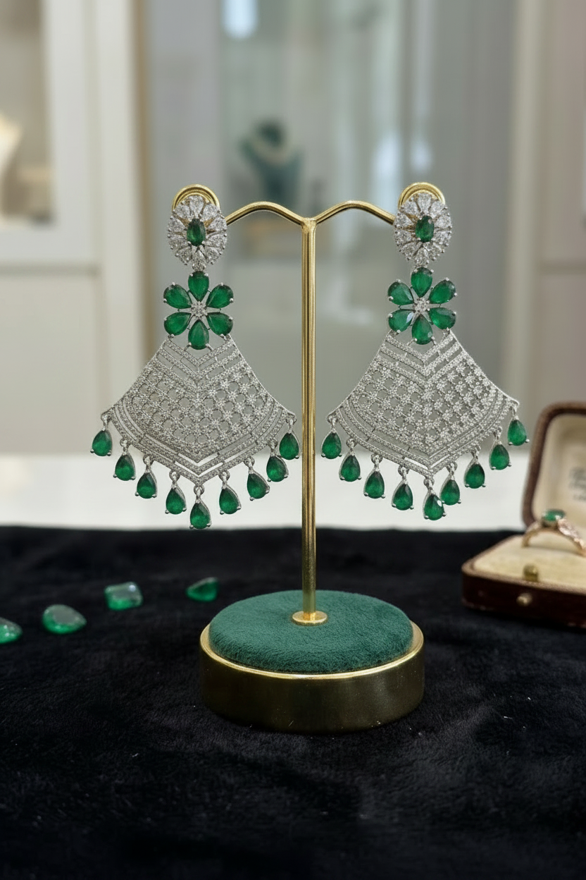 Grand emerald green and American Diamond geometric mesh statement earrings.