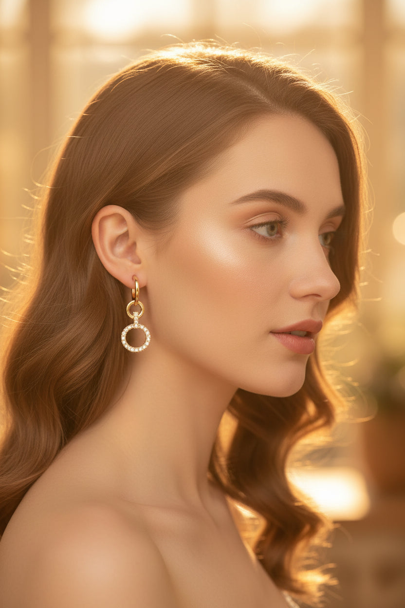Close-up of 3cm rose gold finish earrings featuring a latticed diamond stud and a tiered teardrop drop.