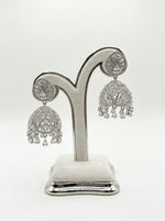 Close-up of American diamonds (cubic zirconia) on silver jhumka earrings