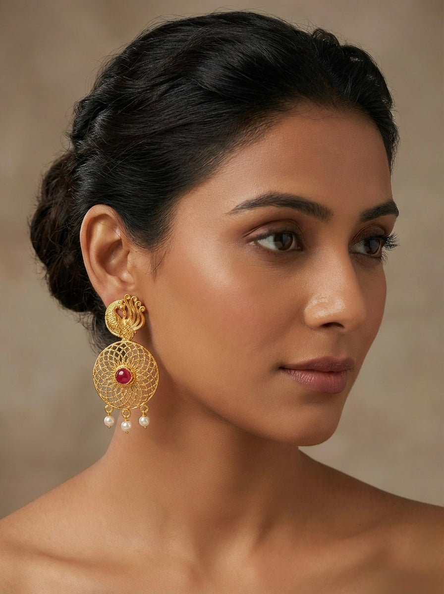 Close-up of Intricate Peacock Motif on Golden Party Wear Earrings
