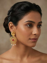 Close-up of Intricate Peacock Motif on Golden Party Wear Earrings