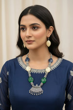 Close-up of a woman styled in a chic silver bead necklace set; high-shine English jewellery aesthetic perfect for party wear, gala dinners, and luxury fashion styling.