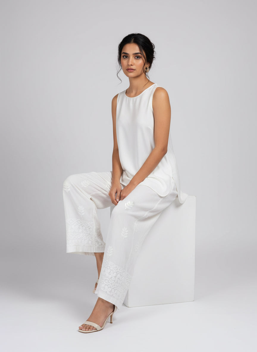 Close-up of hand-embroidered floral Chikankari on modal palazzo pants