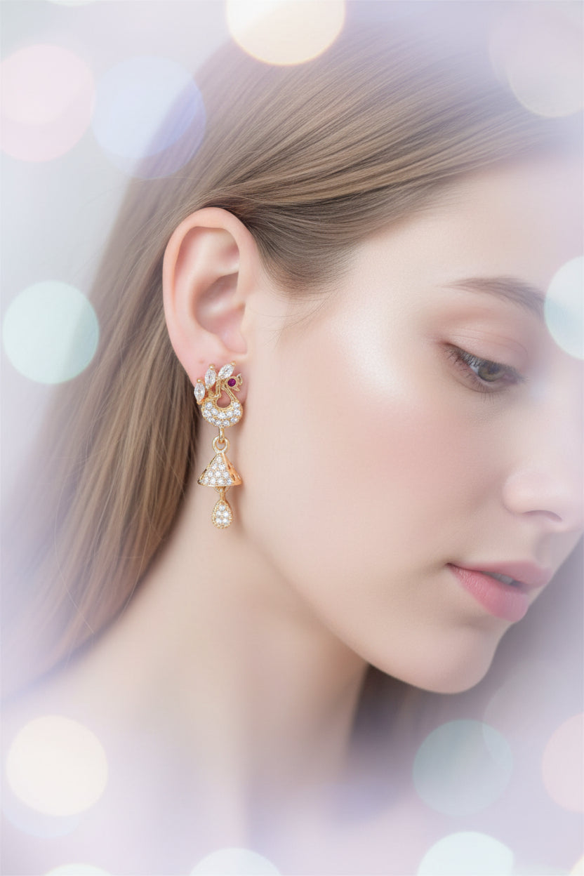 Close-up of the 3cm Mayura rose gold AD peacock earrings featuring a stone-encrusted bird motif and a hanging jhumka drop.