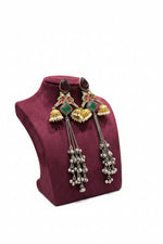 Close-up of the circular Kundan stud showing the intricate floral stone setting and the delicate seed pearl halo.