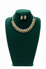 Close-up of the square-cut yellow gemstone and the intricate floral metalwork of the oxidised silver collar.