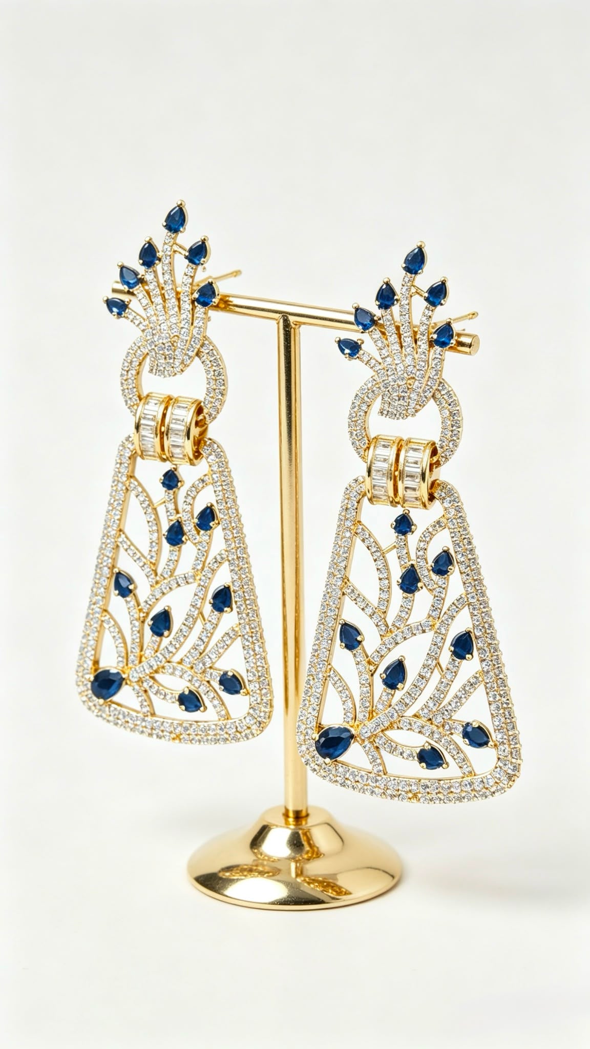 Close-up shot of Royal Sapphire Filigree statement drop earrings with brilliant blue stones.