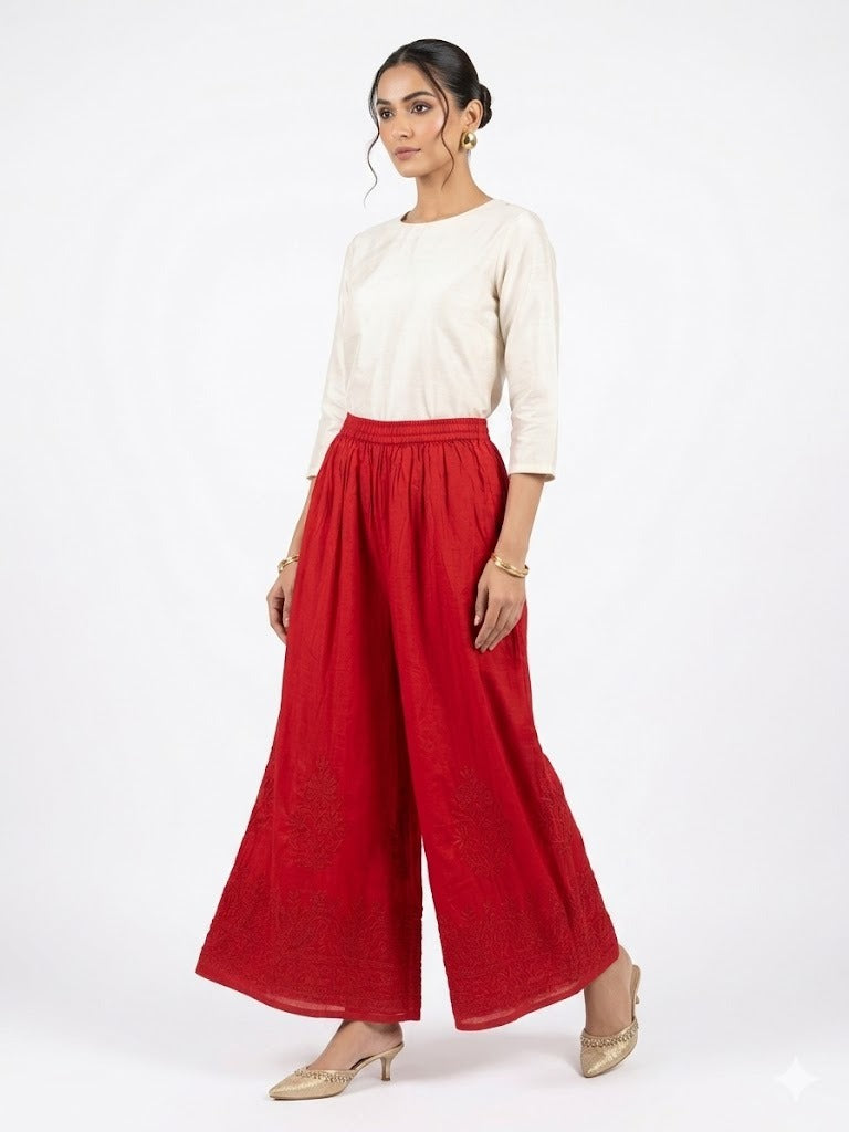 Crimson red cotton wide leg plazzo pants are being worn by a model. 
