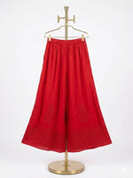 Crimson red cotton wide leg plazzo pants are displayed on a stand. 