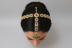 Maang tikka matching the multicolour golden bridal necklace set