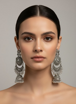 Pair of silver oxidised earrings with deer figureby famaza couture 