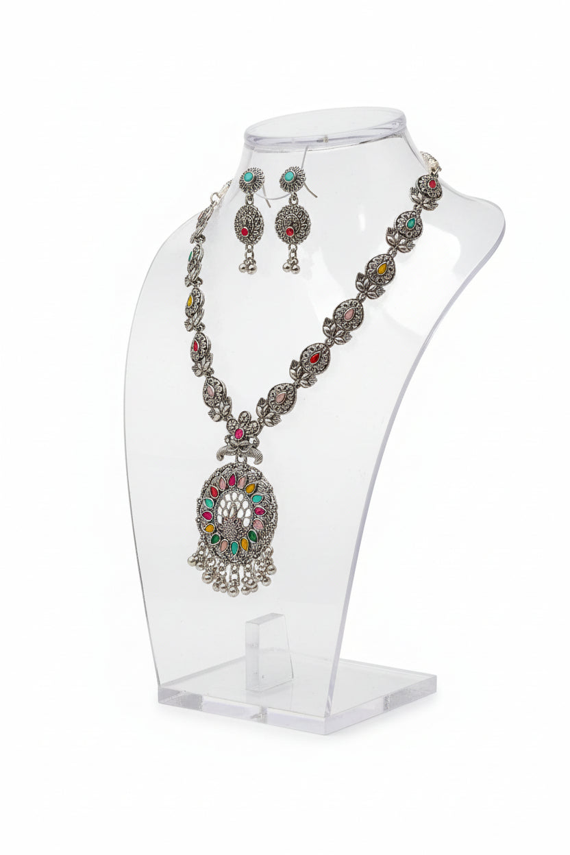 Detailed shot of the multicolor stone inlays, and silver-tone bead drops on the necklace pendant.