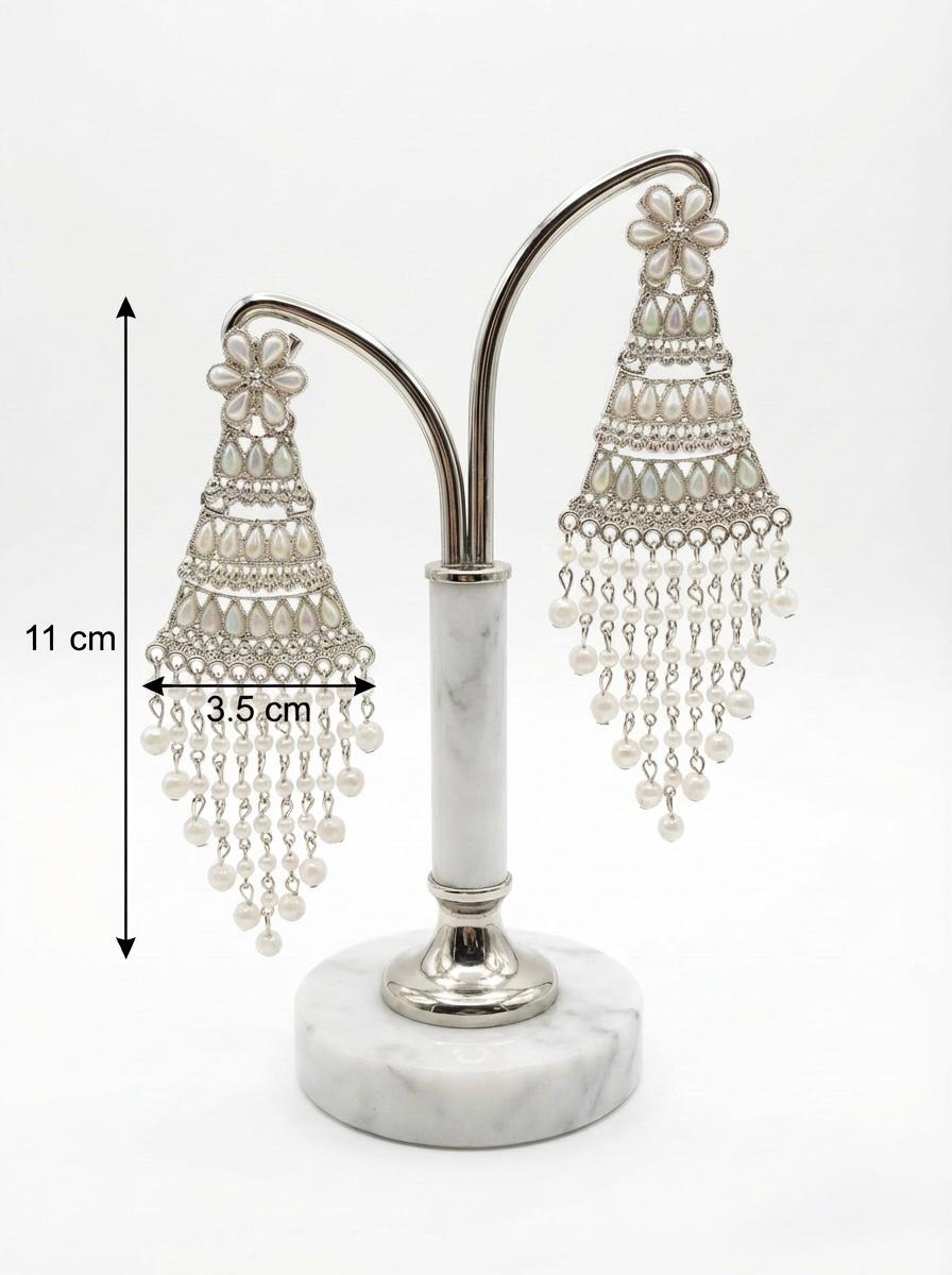 Detailed view of silver filigree work and iridescent teardrop accents on elegant pearl statement earrings with measurments.