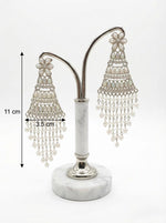 Detailed view of silver filigree work and iridescent teardrop accents on elegant pearl statement earrings with measurments.