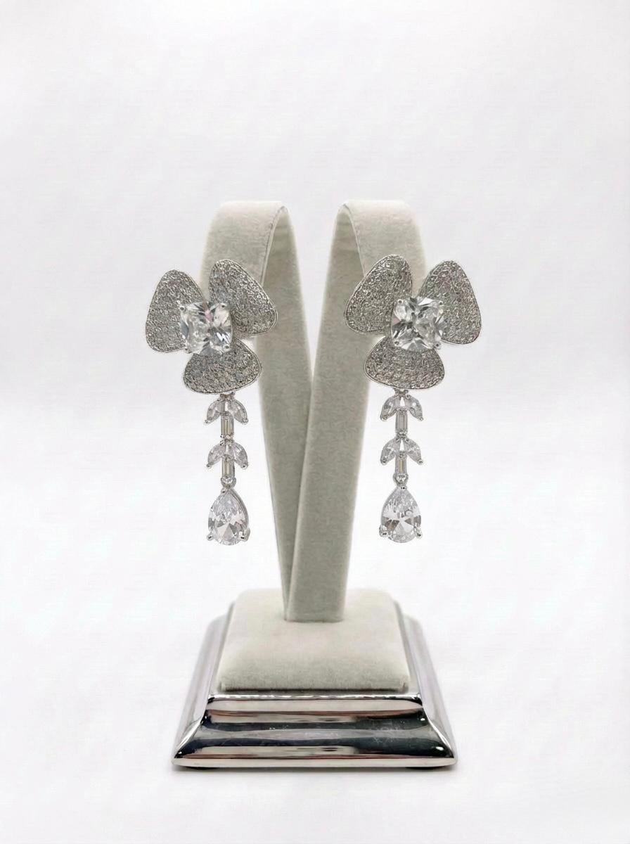  Detailed view of the petal-inspired silver American Diamond jewellery, highlighting the shimmering pavé setting and teardrop crystal finish.