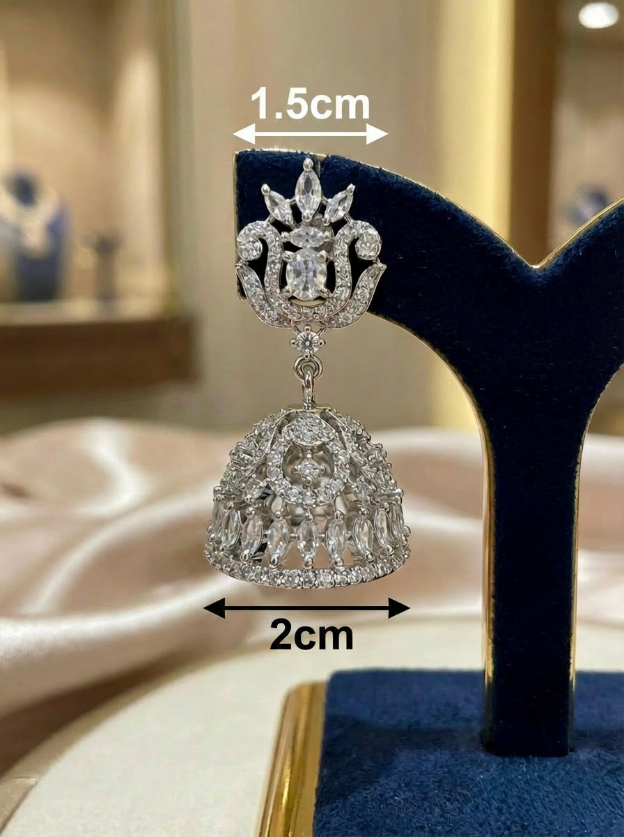 Diamond jhumka earring on a stand with measurements indicated
