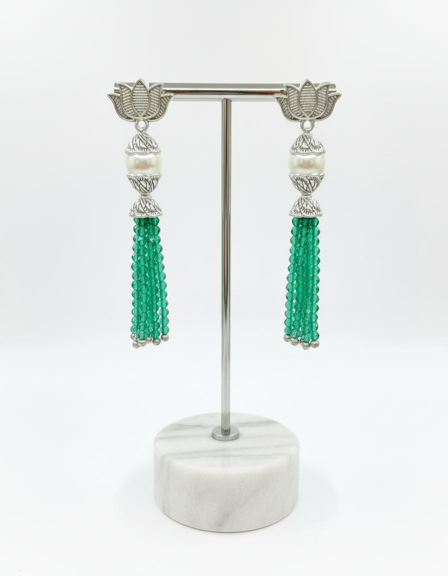 Earrings with Lotus flower stud than white pearl and than bottle green colour glass beads multi layers in hanging design. 