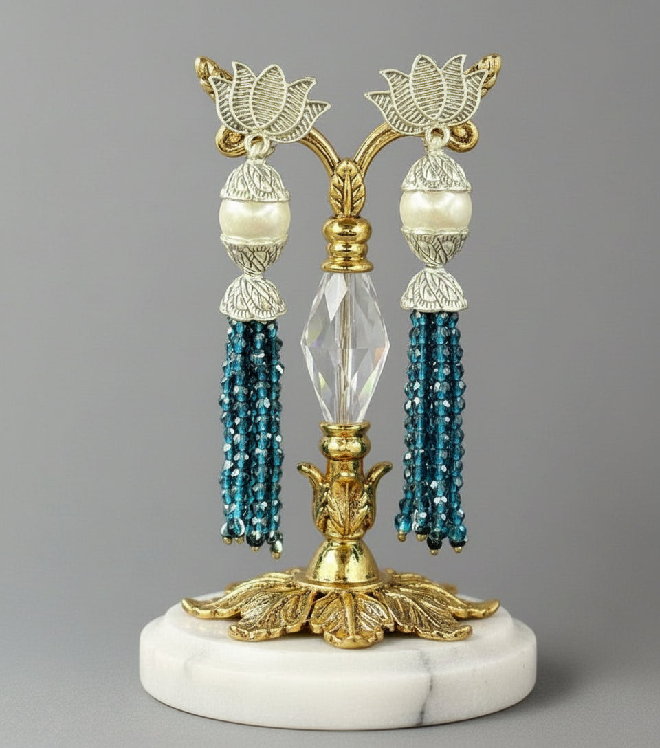 Earrings with Lotus flower stud than white pearl and than navy blue colour glass beads multi layers in hanging design. 