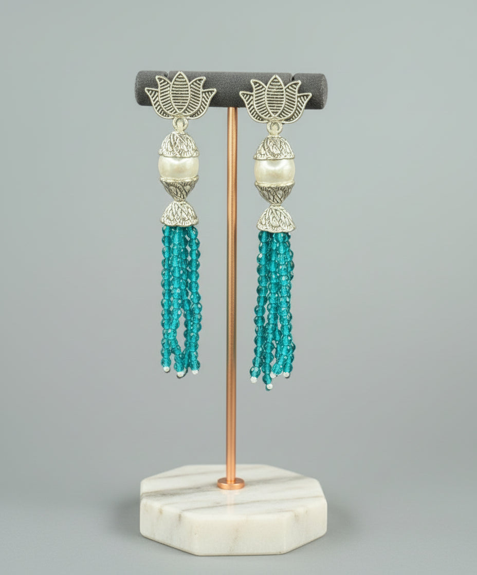 Earrings with Lotus flower stud than white pearl and than sky blue colour glass beads multi layers in hanging design. 
