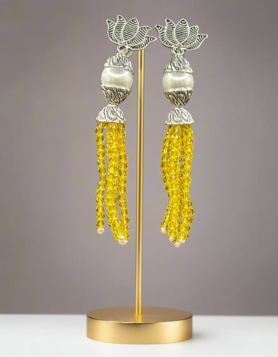 Earrings with Lotus flower stud than white pearl and than yellow colour glass beads multi layers in hanging design. 