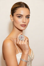 Elegant woman wearing Silver & Pink American Diamond Ring from Famaza Couture Luxury Collection on red carpet — premium snowflake halo statement jewelry.