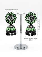Elegant black brass jhumka earrings featuring a refreshing mint green stone floral stud and matching mint stone inlay on the jhumka dome.