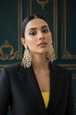 Elegant bridal jewellery look featuring handcrafted rose gold tassel earrings with vibrant crystals, perfect for party wear and wedding guest attire.