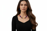 Elegant gold-tone jewelry set featuring lustrous pearl drop earrings and a link necklace with deep crimson resin cabochons for formal party wear.