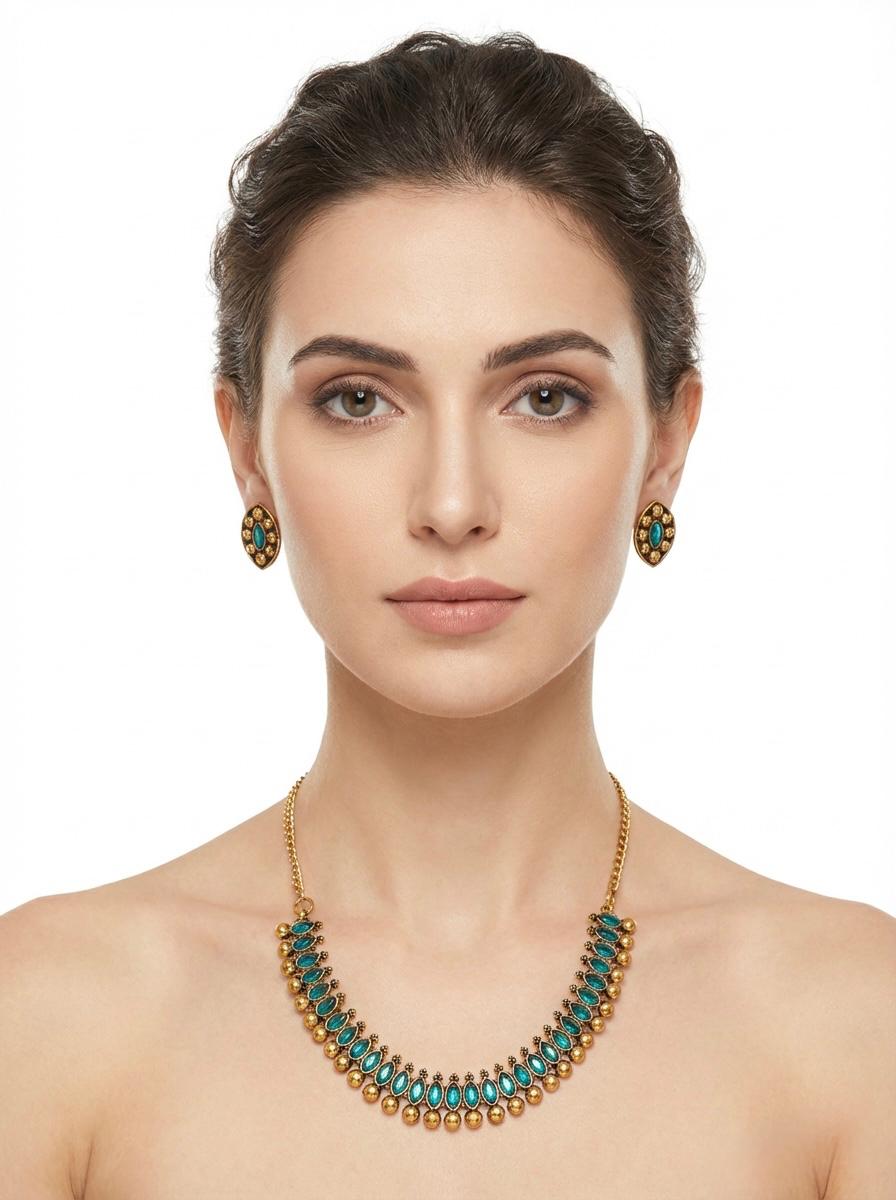 Elegant side-profile shot of a girl wearing the green stone gold-plated necklace and matching studs, showcasing the set's brilliant shine and festive appeal.