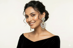Model showcasing luxury canary yellow and silver crystal chaand bali statement earrings.