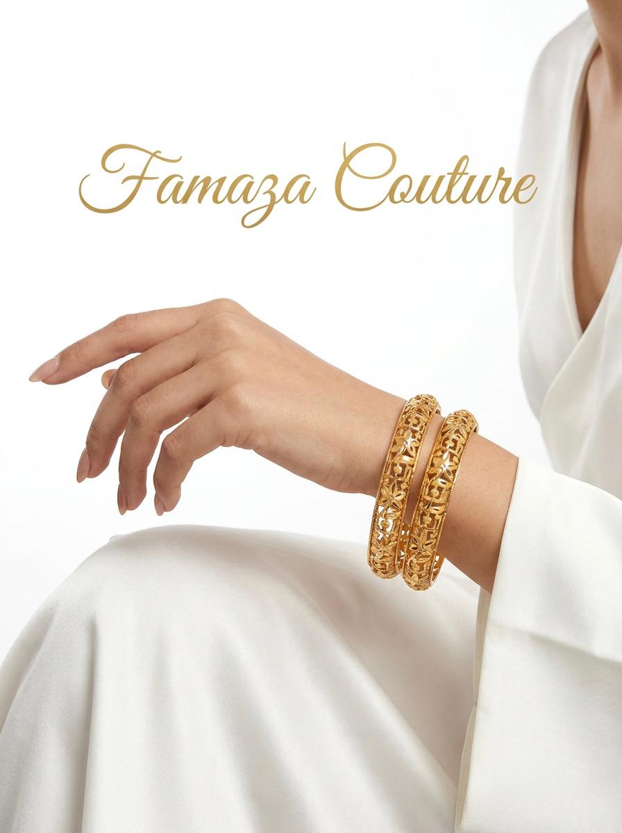 A lifestyle image showcasing a pair of micro-gold plated copper bangles with an intricate floral lattice design, worn by a model in white silk attire with the Famaza Couture logo.