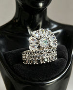 Fan Halo Tiered Ring with white crystal fan halo and silver & black multi-tiered band, luxury designer jewelry displayed on elegant black jewelry stand